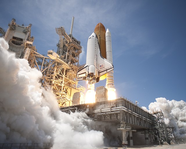 Rockets, like the Space Shuttle Atlantis, propel matter in one direction to push the craft in the other. This means that the mass being pushed, the ro
