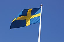 Swedish flag flying from a flagpole Swedish flag (8044071047).jpg