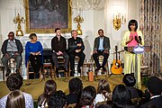 First Lady Michelle Obama hosts an interactive student workshop event in the State Dining Room of the White House. Joining the First Lady on stage, from left, are: Sam Moore, Mavis Staples, Justin Timberlake, Charlie Musselwhite and Ben Harper. (9 April 2013)
