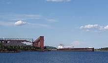 The St. Clair backing into the iron ore loading dock at Silver Bay, Minnesota, to take on taconite pellets The St. Clair backing into the iron ore loading dock at Silver Bay, Minnesota, to take on taconite pellets.jpg