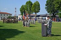 U.S. Army Gen. David M. Rodriguez, at the podium, the commanding general of U.S. Africa Command, addresses the audience during the change of command ceremony of U.S. Army Africa (USARAF) on the grounds 140603-A-JM436-246.jpg