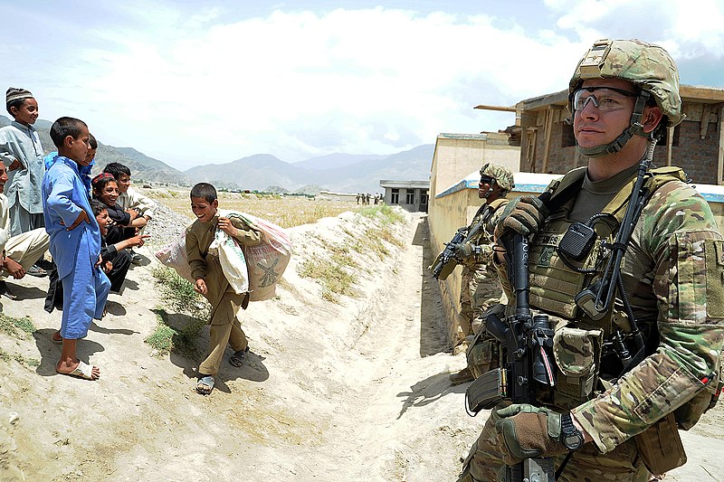 File:U.S. Army Staff Sgt. Joel Miles, right, and Spc. Roy Jerue, second from right, both with Alpha Company, 1st Battalion, 143rd Infantry Regiment, Texas Army National Guard, provide security and joke with Afghan 120526-F-NG741-233.jpg