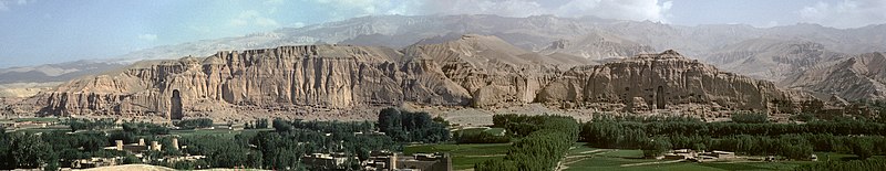 Panorama of the northern cliff of the Valley of Bamyan, with the Western and Eastern Buddhas at each end (before destruction), surrounded by a multitude of Buddhist caves.[11]