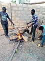 Young men in Tamale Preparing a slaughted sheep to peel of it's hide