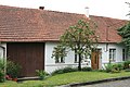 Čeština: Obec Závist v okrese Blansko. Dům č. 22 nedaleko návsi s plodící třešní u vchodu. English: Závist (Blansko District), Czech Republic. Village house.