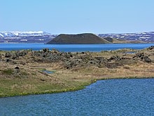 Mývatn lake, surrounded by lush vegetation