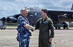 A member of the RAAF (at left) wearing the General Purpose Uniform A RAAF officer and an USAF officer pose in front of a B-52 at RAAF Base Darwin in December 2018.jpg