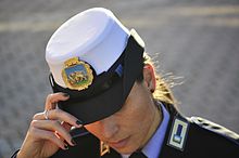 Agente of the Polizia Locale del Veneto wearing a bowler cap, typically in white Agente di Polizia Locale del Veneto.jpg