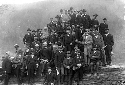 Geological field excursion to Harpers Ferry, West Virginia, April 30, 1897, following the George Huntington Williams Memorial Lectures delivered by Sir Archibald Geikie at Johns Hopkins University. The photograph was taken by Joseph S. Diller at Jefferson Rock, above Harpers Ferry. Individuals in photo include (starting at top): Cleophas C. O'Harra, Sir Archibald Geikie, Frederick H. Newell, Henry B. Kummel, George Burbank Shattuck, Rollin D. Salisbury, Arthur Clifford Veatch, Louis Marcus Prindle, Harry F. Reid, Charles R. Van Hise, Cleveland Abbe, Jr., George Willis Stose, Thomas Leonard Watson, Edward Vincent D'Invilliers, Clarence Wilbur Dorsey, Frederick J.H. Merrill, Louis A. Bauer, Arthur Coe Spencer, William J. McGee, William B. Clark, Rufus Mather Bagg, Frank Hall Knowlton, Robert T. Hill, Heinrich Ries, Frank D. Adams, Arthur P. Coleman, Timothy William Stanton, Oliver L. Fassig, Samuel F. Emmons, George F. Becker, Albert Berthold Hoen, George O. Smith, James F. Kemp, Bailey Willis, David White, Edward Bennett Mathews, Charles D. Walcott, John W. Powell, Joseph Stanley-Brown, Joseph Austin Holmes, Charles Willard Hayes, Leonidas Chalmers Glenn, Henry S. Williams. American Geologists WVa 1897.jpg