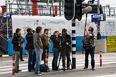 Camera crew doing a reportage on the streets. Amsterdam, The Netherlands