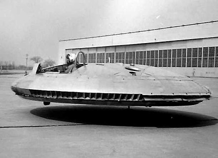 Avrocar 59-4975 after modifications, was tested without the canopies and incorporating the perimeter "focusing" ring c. 1961. Tests showed that the heat was so oppressive that all instruments were baked brown after only a few flights.