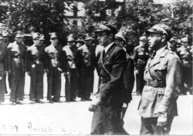 Begin reviews a Betar lineup in Poland in 1939. Next to him is Moshe (Munya) Cohen