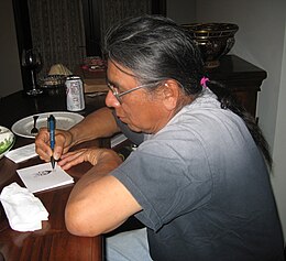 Absentee Shawnee enrolled member, artist Benjamin Harjo, Jr. sketching Benjamin harjo jr.jpg