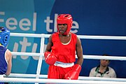 Deutsch: Boxen bei den Olympischen Jugendspielen 2018 Tag 12, 18. Oktober 2018 - Finale Fliegengewicht Mädchen – Martina La Piana (Italien, blau) schlägt Adijat Gbadamosi (Nigeria, rot) 5-0; Ringrichter ist James Beckles (Trinidad und Tobago). English: Boxing at the 2018 Summer Youth Olympics on 18 October 2018 – Girl's flyweight Gold Medal Bout - Martina La Piana (Italy, blue) beats Adijat Gbadamosi (Nigeria, red) 5-0; Referee is James Beckles (Trinidad and Tobago). Español: Boxeo en los Juegos Olímpicos Juveniles de Verano de 2018 en 18 de octubre de 2018 - Combate a medalla de oro de peso mosca para mujeres: Martina La Piana (Italia, azul) le gana a Adijat Gbadamosi (Nigeria, roja) 5-0; El árbitro es James Beckles (Trinidad y Tobago).