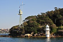 Sydney's tripod foremast at Bradleys Head Bradleys Head Light and HMAS Sydney foremast.jpg