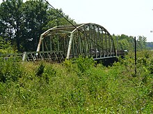 Little Bridge near east Mount Carmel at the western terminus of SR 64. Also known as "The Little Monster" because of the many accidents there, it, like the main bridge, was built to the width standards of the 1930s. It was replaced by a new bridge in 2010. The grassy area in the foreground is now occupied by the new road and bridge. Bridge near PSI.JPG