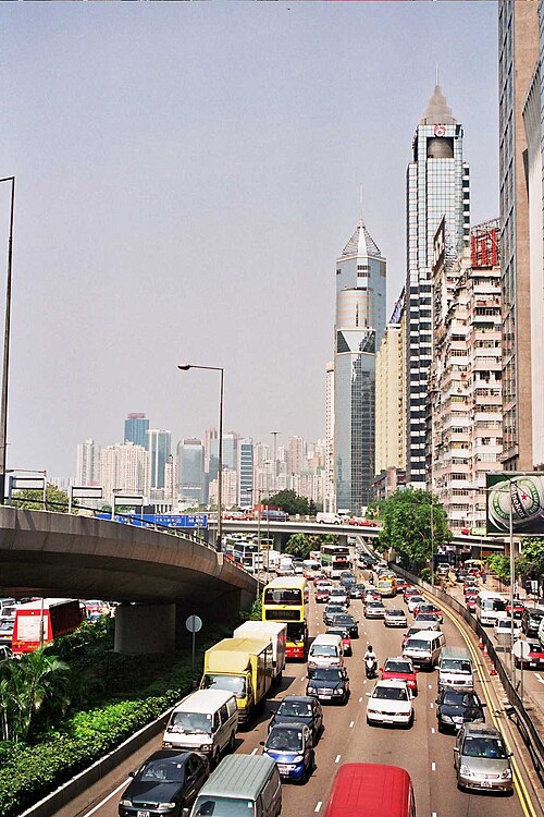 Gloucester Road in Wan Chai in August 2004, near the Wan Chai Sports Ground. East-bound traffic is to the left hand side of the flyover.