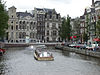 Canal tour boats follow one another