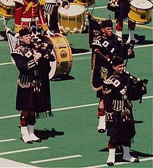 CDS General de Chastelain (left), on parade with the Pipes and Drums on 30 June 1990. Cdsdechastelain.jpg