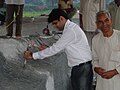 Dewas taking part in the carving.JPG