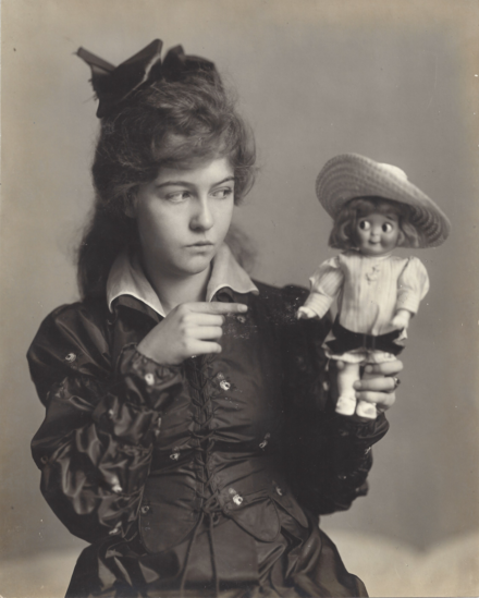 Dorothy Gish with a doll.