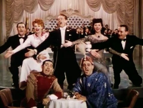 Singing "Friendship", back row L–R: Gene Kelly, Lucille Ball, Red Skelton, Virginia O'Brien and Tommy Dorsey; front: Rags Ragland, Zero Mostel