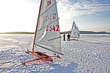 Iceboats parked in irons with sails loose and not generating power, but flapping like a flag. Eissegler Hemmelsorfer See.jpg