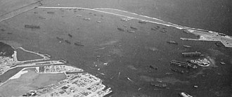 The harbor in 1945 Glass Breakwater Guam in 1945 (cropped).jpg