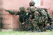 Gurkhas undergoing an urban warfare exercise in the United States. Note the kukri on the webbing of the nearest soldier. Gurkhas exercise DM-SD-98-00170.jpg