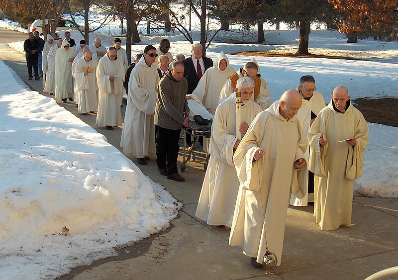 File:HTA funeral of Bro Boniface OCSO bringing in the body day before.jpg