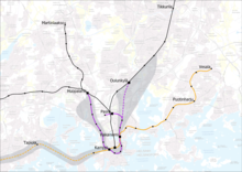 The Metro Office's 1971 proposal for a rail network in Helsinki. Orange = the first metro line, purple = the U metro, black = railways, dashed lines = reservations, grey area = area of tolerance. Basemap from 2018. Helsinki metro plan 1971.png