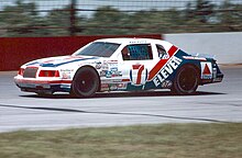 Kyle Petty, driving the 7/Eleven Ford at Pocono in 1985 Kyle Petty Wood Brothers Racing Ford Pocono 1985.jpg