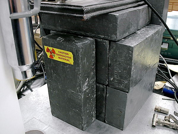 A lead castle built to shield a radioactive sample in a lab, being a form of lead shielding.