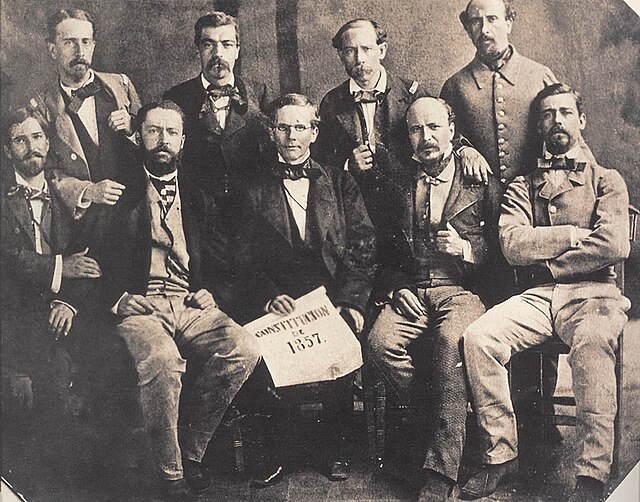 Liberals posing with a copy of the Constitution of 1857.
