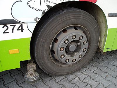 The kerb guide wheel of a guided bus in Mannheim, Germany