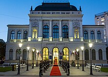 The National Gallery hosts the opening ceremony of the 2019 NATO Military Committee Conference National Gallery of Slovenia at night 2019 (48728021908).jpg