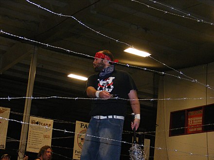 Record-setting two-time champion Nick Gage; he has  the longest singular reign for the title at 722 days, and he also has the longest combined reign at 828 days