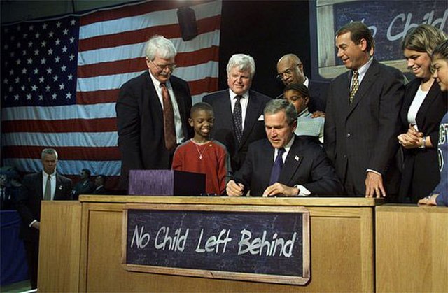 President George W. Bush signing the No Child Left Behind Act.