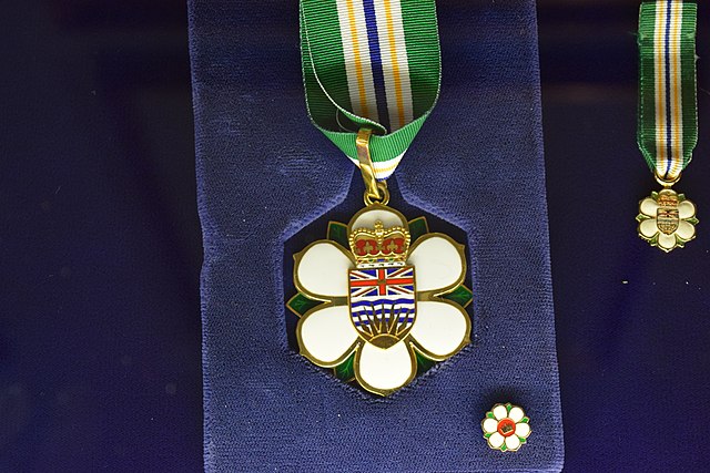 The full-size insignia of the Order of British Columbia, with miniature medal and lapel pin