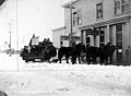 Passengers on the Edward S Orr stagecoach outside the Copper Block building, Valdez, Alaska, circa 1900 (AL+CA 3010).jpg
