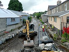 Pipelaying during the flood protection works in 2009 Pipelaying in the Afon Brennig, Tregaron, Ceredigion - geograph.org.uk - 1436344.jpg