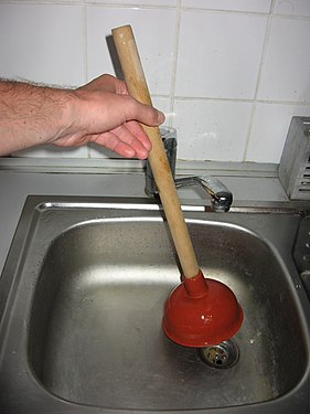 A plunger being used to clear a drain. For home use, it is best to have a separate plunger for dish sinks and toilets for sanitary reasons.