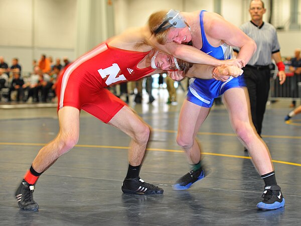 Jake Sueflohn of Nebraska (left) grapples with Cole VonOhlen of Air Force at the Cliff Keen Invitational on December 1, 2012