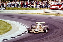 Riccardo Patrese - Arrows FA1 at Druids at the 1978 British Grand Prix (50050521097).jpg