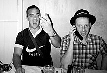 Robbie Williams left the band in 1995 Robbie paparazzi V sign.jpg