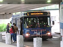 Commuters boarding buses at the Norwich Transportation Center.