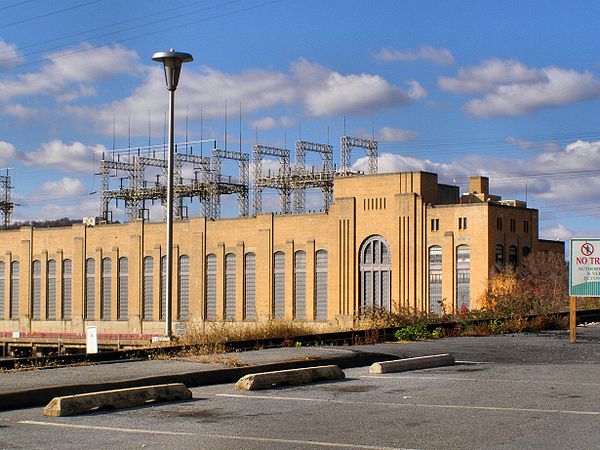 The Safe Harbor Dam generates 25 Hz railroad power via two turbines in the east end of the turbine hall and an M-G set outside against the Dam face.