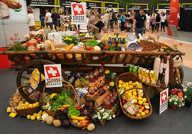 A cart displaying food produced in Switzerland.