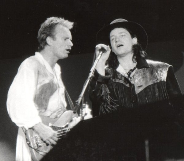 Sting and Bono performing during A Conspiracy of Hope in June 1986. U2's appearance on the tour helped them focus their new material being written for