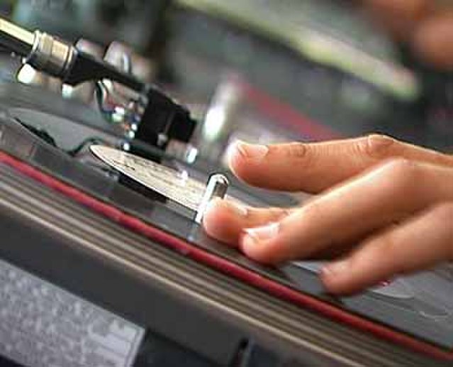 A DJ scratching a record